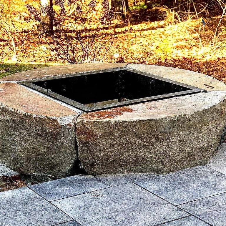 Application image for Reclaimed D-Radius Curbstone. The image shows this material being used in an outdoor fire concepts application. This is a landscape stone for outdoor applications. Suitable for general use, freeze-thaw conditions and low heat absorption surfaces situations. Relatively higher in price.