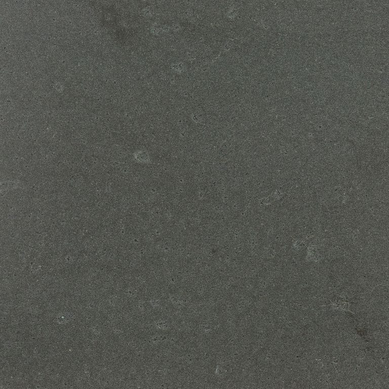 Color/Finish variation image for Ankar Black Basalt. The surface finish shown is leathered. Dominant colors shown are black and gray; with a black secondary. The color mix creates a cool feeling. Solid, fine speckled and blotched color patterns.