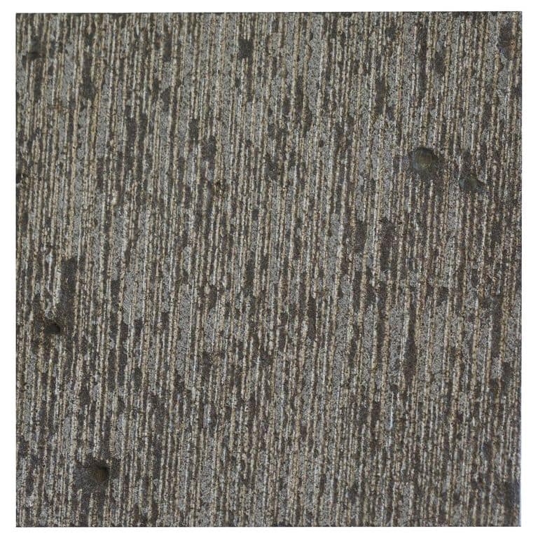 Color/Finish variation image for Ankar Black Basalt. The surface finish shown is fine adze. Dominant colors shown are black and gray; with black and purple secondaries. Exhibits "movement" and the color mix creates a cool feeling. Linear and blotched color patterns.