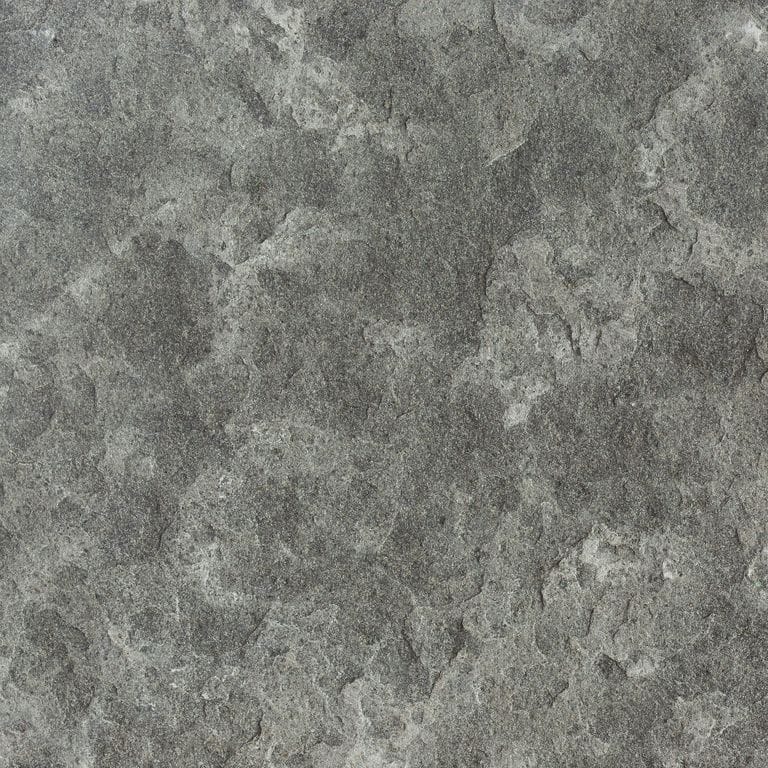 Color/Finish variation image for Ankar Black Basalt. The surface finish shown is flamed. Dominant colors shown are black, green and gray; with a brown secondary. Exhibits "movement" and the color mix creates a cool feeling. Regular, blotched and cloudy color patterns.