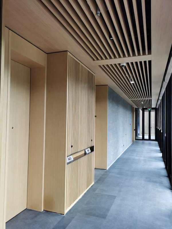 Application image for Basalt - Ankar Black. The image shows this material being used for interior floor, full bed veneer and thin veneer. The dominant color shown is gray. The color mix creates a cool feeling.