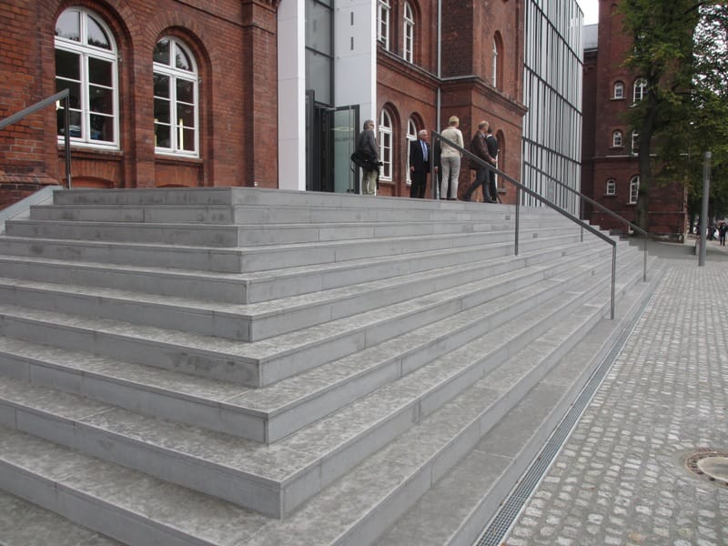 Application image for Basaltite. The image shows this material being used in a treads application. This is a building and landscape stone for indoor and outdoor commercial and residential applications. Suitable for general use, freeze-thaw conditions, high traffic areas, low slipperiness surfaces and high heel compatibilty situations. Moderate to higher on the price spectrum.