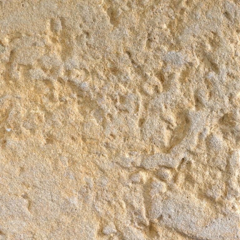 Color/Finish variation image for Glacier Buff Limestone. The surface finish shown is sand blasted. Dominant colors shown are beige and tan; with brown, orange/rust and cream secondaries. Exhibits "movement" and the color mix creates a warm feeling. Fine speckled, blotched and swirled color patterns.