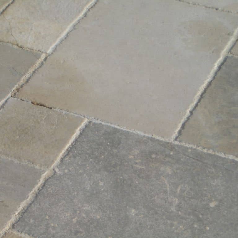 Close-up image for Mixed Blend Limestone. Dominant colors shown are beige and gray; with green and purple secondaries. Regular and cloudy color patterns.