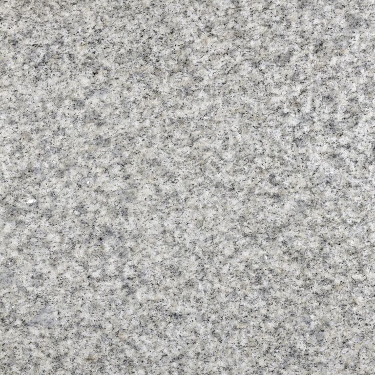 Feature image for Old Berkshire Granite. The dominant color shown is gray; with beige, white and cream secondaries. The color mix creates a cool feeling. Speckled color pattern. Contains some mica and mineral inclusions.
