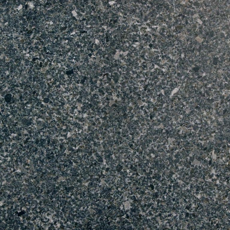 The surface finish shown is honed. Dominant colors shown are black, blue and gray. The color mix creates a cool feeling. Coarse speckled color pattern.