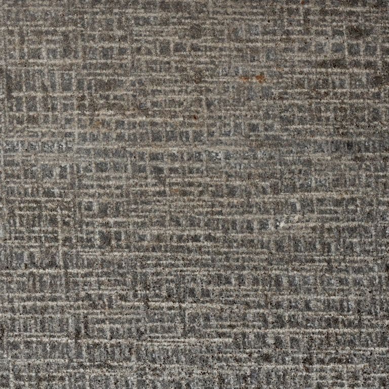 Best close-up image for Basalt - Ankar Black Microhole. The surface finish shown is canvas. The dominant color shown is brown; with beige, purple and tan secondaries. The color mix creates a warm feeling. Regular and linear color patterns.