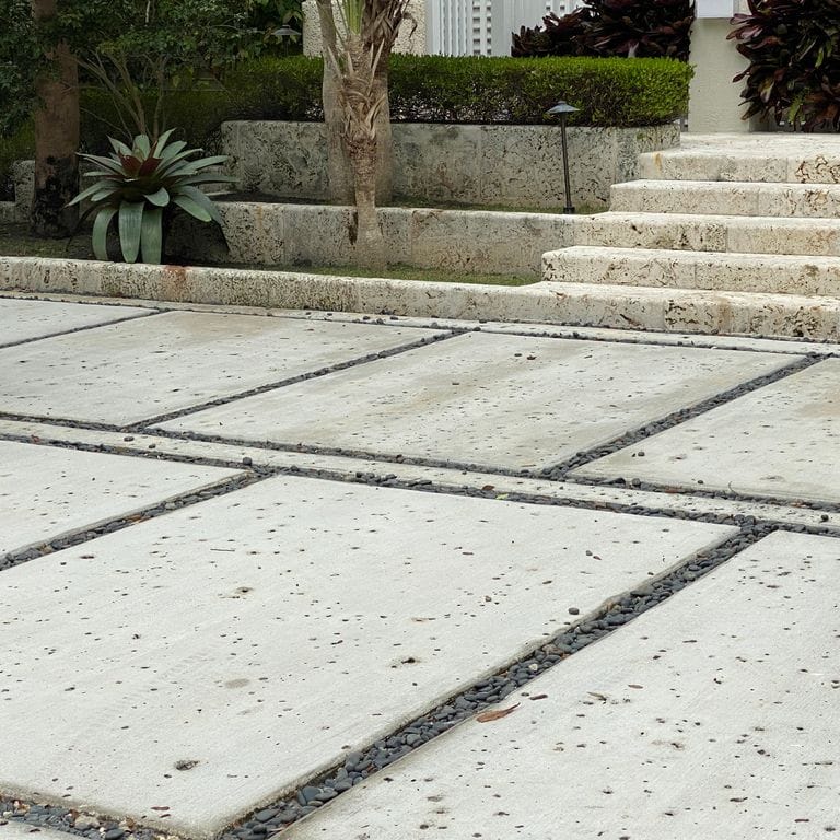 The image shows this material being used for patio pavers and monolithic steps.