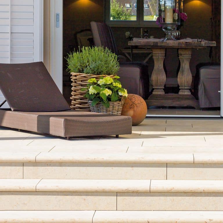 Application image for Bavarian Limestone - Beige. The image shows this material being used for patio pavers and treads. The surface finish shown is honed. Dominant colors shown are beige and cream. The color mix creates a warm feeling. Regular color pattern.