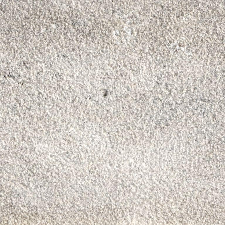 The surface finish shown is bush hammered. Dominant colors shown are beige and gray. Speckled and blotched color patterns.