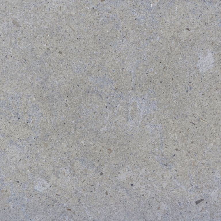 Color/Finish variation image for Blue Peak Limestone. The surface finish shown is brushed. The dominant color shown is gray; with beige, blue and white secondaries. Exhibits "movement" and the color mix creates a cool feeling. Cloudy color pattern.