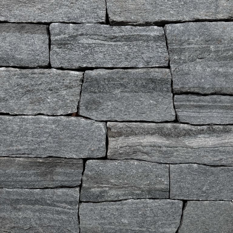 Color/Finish variation image for Chester Granite Veneer. The surface finish shown is split-face. The dominant color shown is gray. The color mix creates a cool feeling.