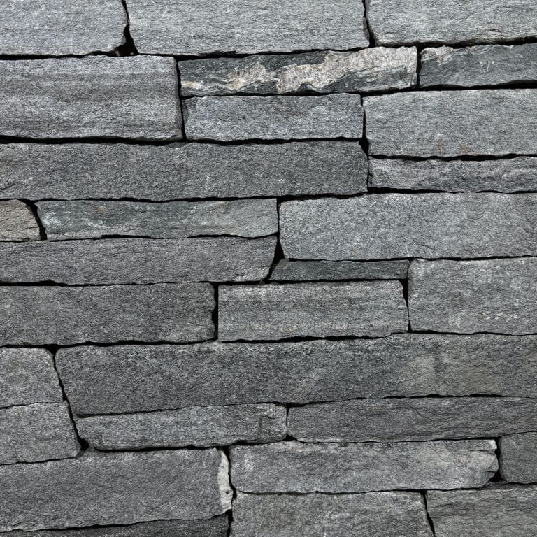 Color/Finish variation image for Chester Granite Veneer. The surface finish shown is split-face. The dominant color shown is gray. The color mix creates a cool feeling.