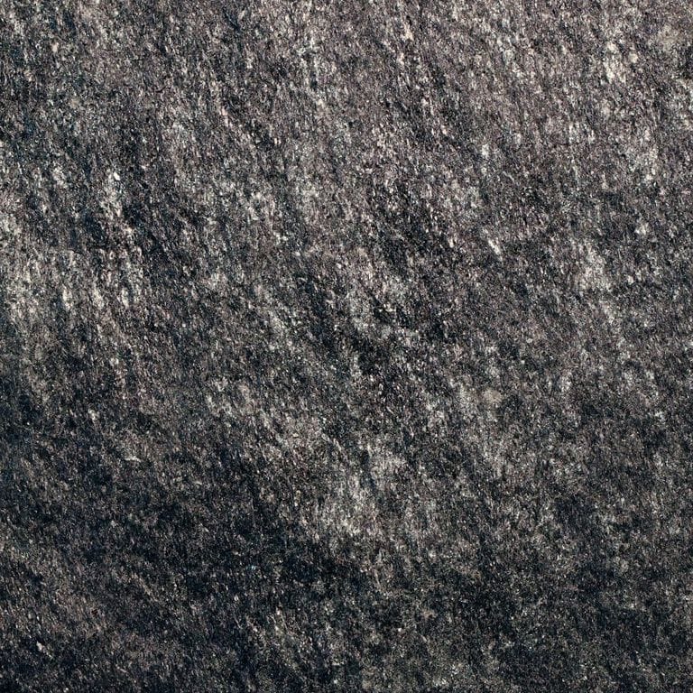 Color/Finish variation image for Raven Hill Granite. The surface finish shown is split-face. The dominant color shown is black. The color mix creates a cool feeling. Regular color pattern. Contains some mica and mineral inclusions.