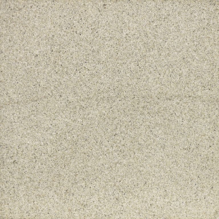 Swatch image cropped for Golden Sandstone. The surface finish shown is sand blasted. The dominant color shown is tan; with gray and cream secondaries. The color mix creates a warm feeling. Fine speckled color pattern.