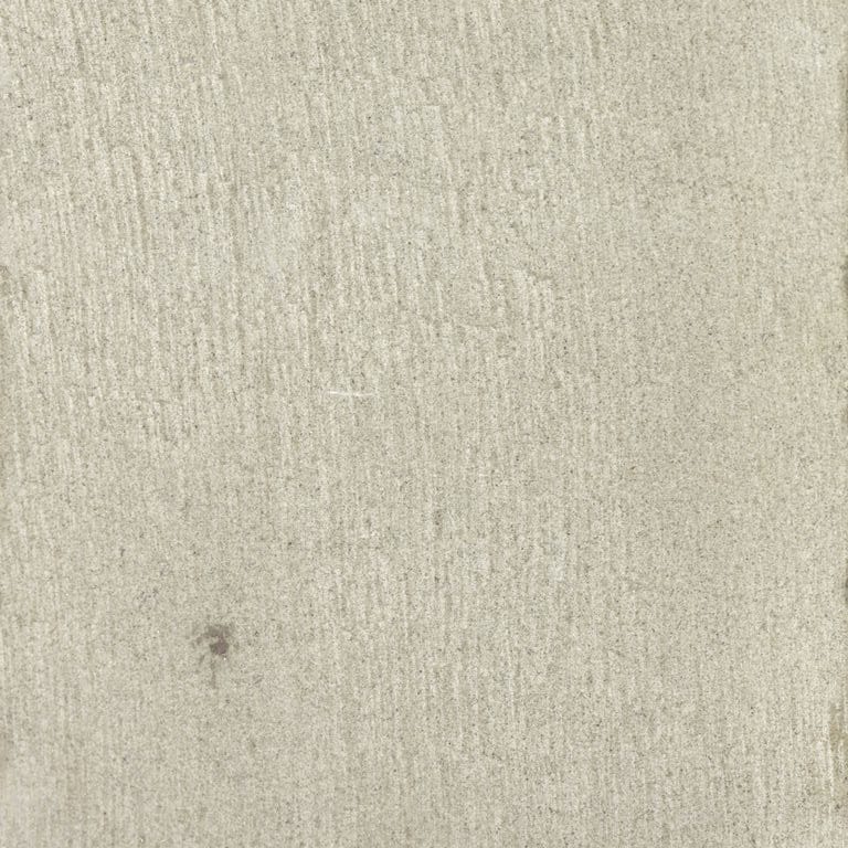 Best close-up image for Golden Sandstone. The surface finish shown is fine adze. The dominant color shown is tan; with white, tan and cream secondaries. Exhibits "movement" and the color mix creates a warm feeling. Solid, regular and linear color patterns.