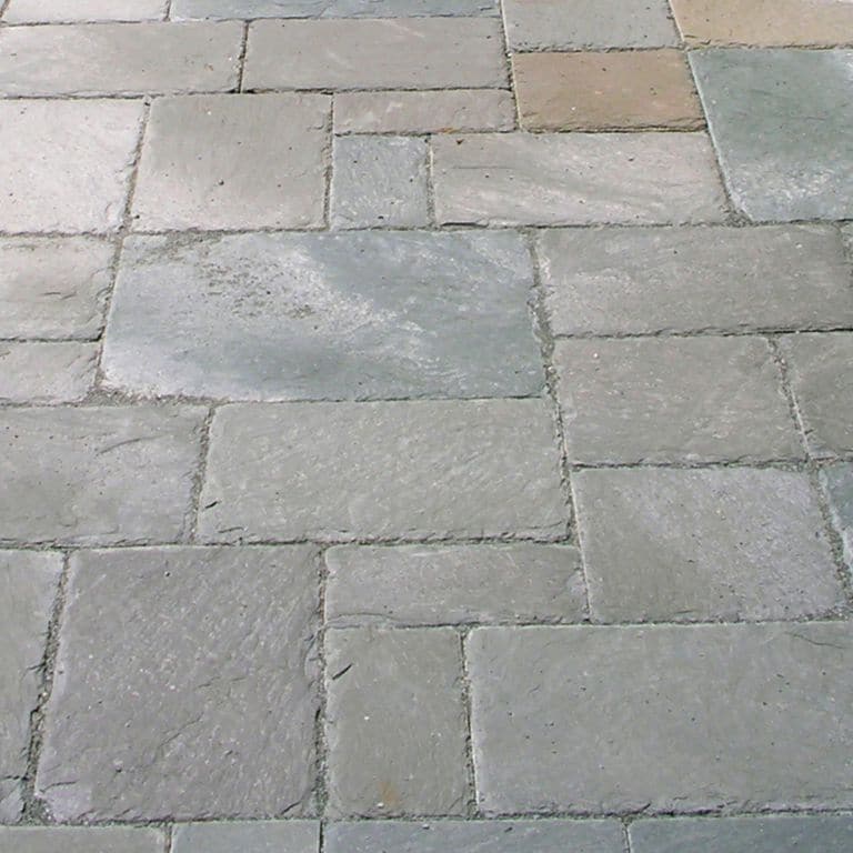 Close-up image for Vermont Slate - Green. The surface finish shown is natural cleft. The dominant color shown is gray; with beige, blue, purple and tan secondaries. The color mix creates a cool feeling. Solid, regular and cloudy color patterns.