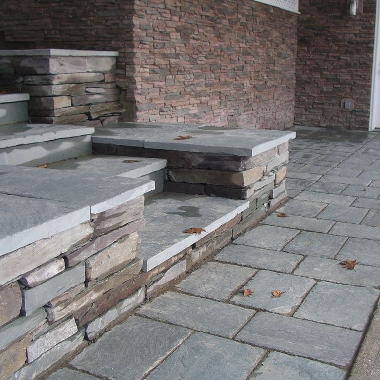 The image shows this material being used for wallstone cap, path pavers and treads.