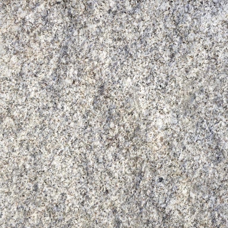 Feature image for Iberian Yellow Granite. Dominant colors shown are beige, gray and white; with a cream secondary. Exhibits "movement" and the color mix creates a warm feeling. Random, speckled, blotched and swirled color patterns. Contains some mica and mineral inclusions.