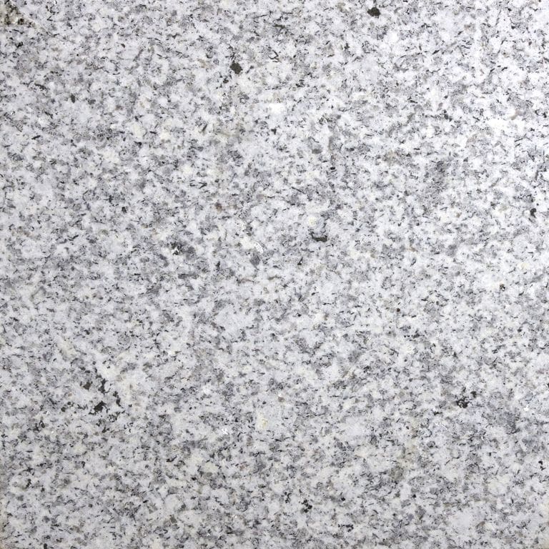 Color/Finish variation image for Iberian Gray Granite. The surface finish shown is sawn. Dominant colors shown are gray and white. The color mix creates a cool feeling. Coarse speckled color pattern.
