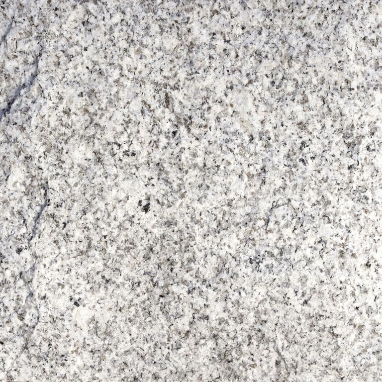 Color/Finish variation image for Iberian Gray Granite. The surface finish shown is split-face. Dominant colors shown are gray and white; with beige and cream secondaries. The color mix creates a cool feeling. Coarse speckled and cloudy color patterns.