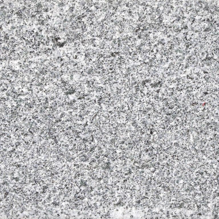 Feature image for Iberian Gray Granite. Dominant colors shown are gray and white. The color mix creates a cool feeling. Speckled color pattern. Contains some mica and mineral inclusions.