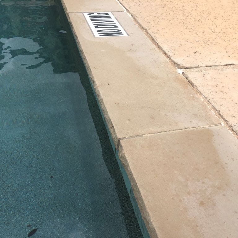 The image shows this material being used for pool coping, pool deck pavers and .
