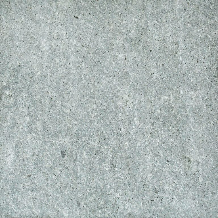 Color/Finish variation image for Atlantic Granite. The surface finish shown is flamed. Dominant colors shown are blue, gray and white. The color mix creates a cool feeling. Regular, fine speckled and cloudy color patterns.