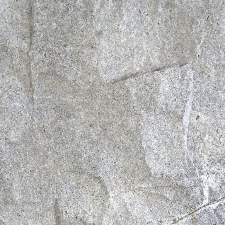 Color/Finish variation image for Atlantic Granite. The surface finish shown is split-face. Dominant colors shown are gray and white; with beige and cream secondaries. Exhibits "movement" and the color mix creates a cool feeling. Random color pattern.