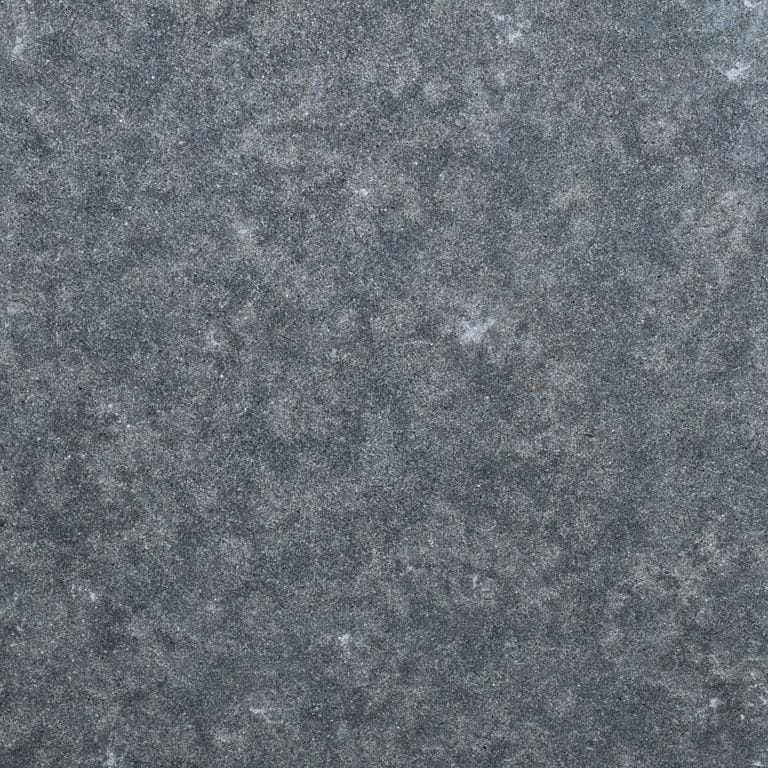 Color/Finish variation image for Polar Gray Limestone. The surface finish shown is flamed. The dominant color shown is gray. The color mix creates a cool feeling.