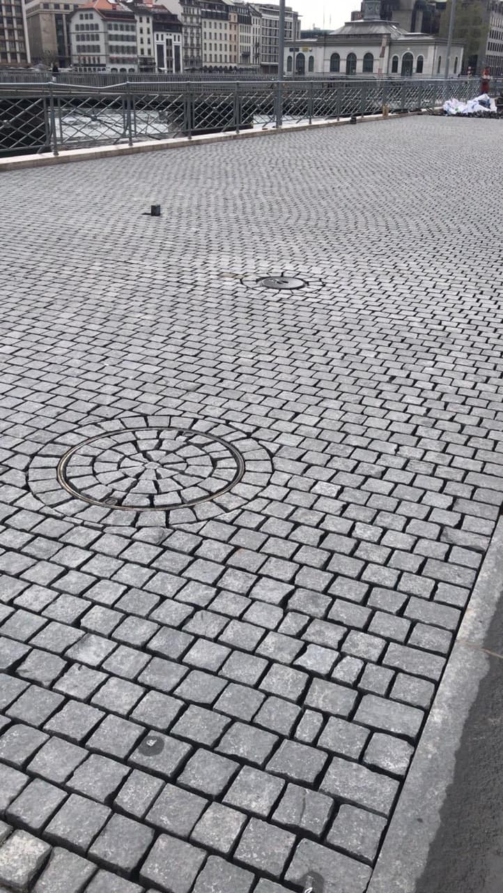 Application image for Polar Gray Limestone. The image shows this material being used for driveway pavers and patio pavers. The surface finish shown is sawn. The dominant color shown is gray. Regular color pattern.