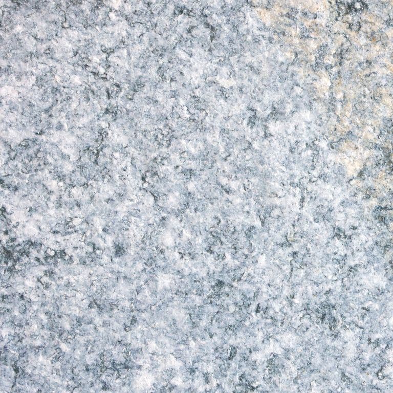 Color/Finish variation image for Gneiss - Pietra Italia Natural Cleft. The surface finish shown is flamed. The dominant color shown is gray. The color mix creates a cool feeling. Coarse speckled color pattern.