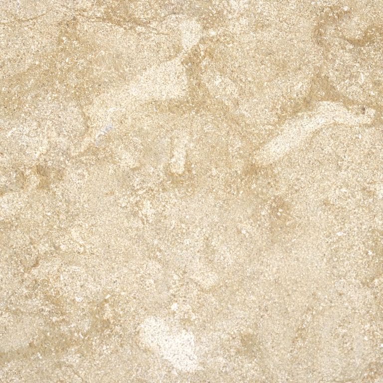 Color/Finish variation image for Cenia Beige Limestone. The surface finishes shown are brushed and bush hammered. Dominant colors shown are beige and tan; with a cream secondary. Exhibits "movement" and the color mix creates a warm feeling. Random, blotched and swirled color patterns.
