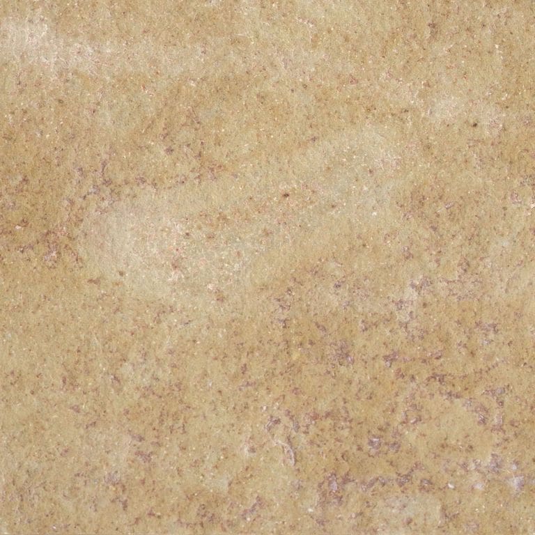 Color/Finish variation image for Cenia Beige Limestone. The surface finish shown is flamed. Dominant colors shown are orange/rust and tan; with beige, brown and purple secondaries. Exhibits "movement" and the color mix creates a warm feeling. Random, blotched and swirled color patterns. Contains mineral inclusions.