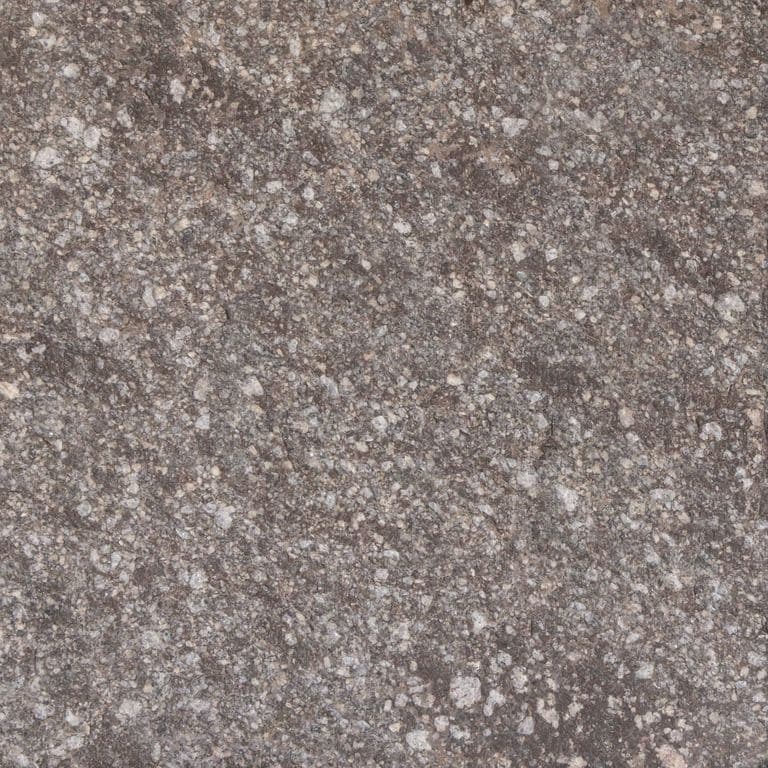 Close-up image for Imperial Roman Porphyry - Brown. Dominant colors shown are gray and purple; with brown, green and tan secondaries. The color mix creates a warm feeling. Coarse speckled color pattern.