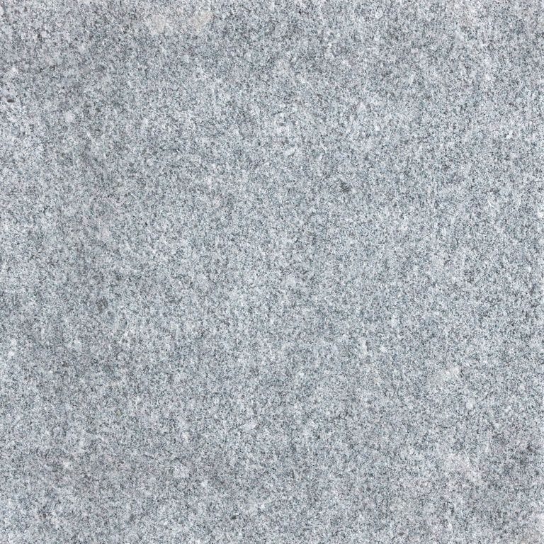 Feature image for Gray Nisa Granite. The surface finish shown is sand blasted. Dominant colors shown are blue and gray; with a white secondary. The color mix creates a cool feeling. Fine speckled color pattern. Contains some mica and mineral inclusions.
