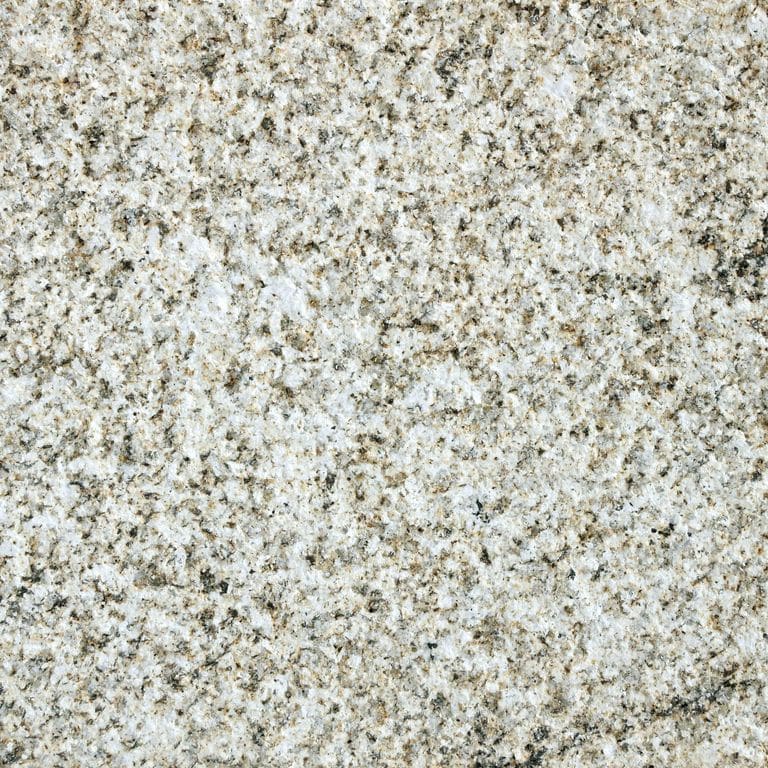 Feature image for Yellow Wheat Granite. The surface finish shown is sand blasted. Dominant colors shown are beige, gray, tan and cream; with brown, orange/rust and white secondaries. The color mix creates a warm feeling. Speckled and random color patterns. Contains some mica and mineral inclusions.