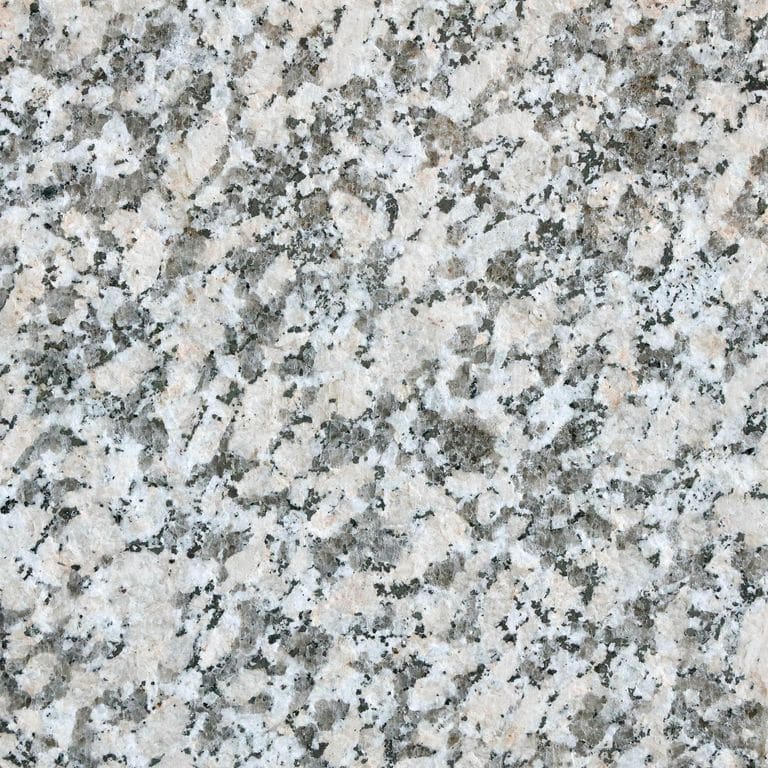 Color/Finish variation image for Lapa Gray Granite. The surface finish shown is flamed. The dominant color shown is gray. The color mix creates a cool feeling. Coarse speckled color pattern.