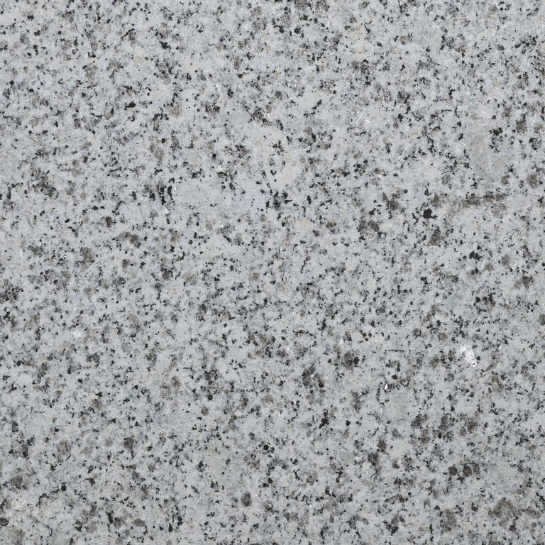 Color/Finish variation image for Gray Salis Granite. The surface finish shown is sand blasted. Dominant colors shown are gray and white. The color mix creates a cool feeling.