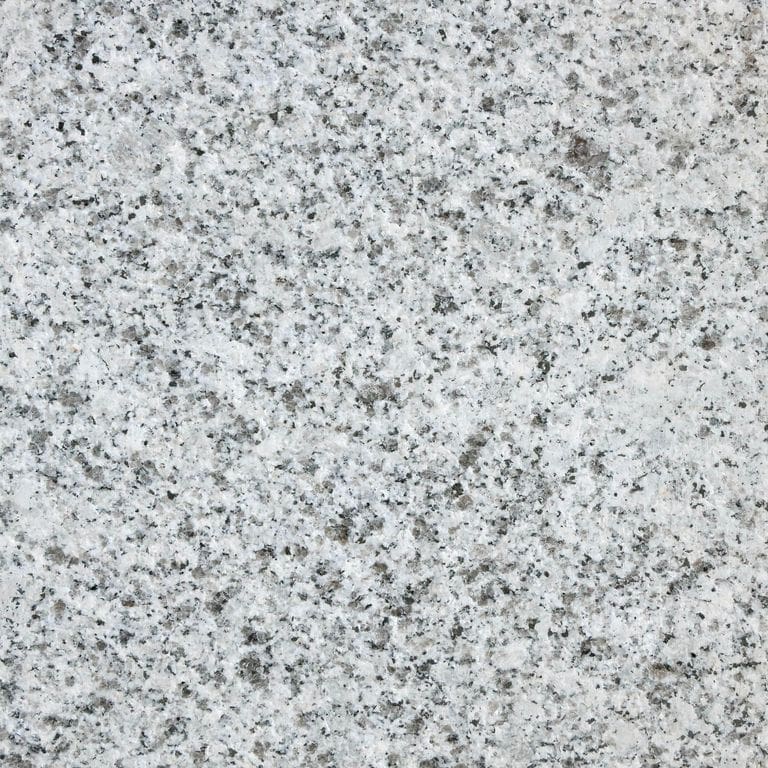 Feature image for Gray Salis Granite. The surface finish shown is flamed. Dominant colors shown are gray and white; with beige, black, blue, pink and cream secondaries. The color mix creates a cool feeling. Speckled color pattern. Contains some mica and mineral inclusions.