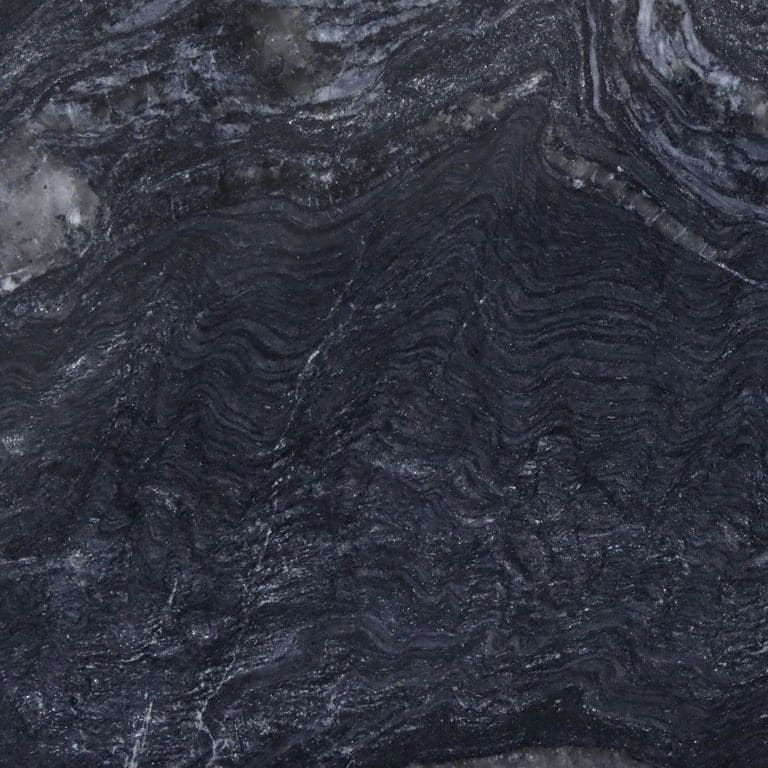 Feature image for Cloudy Night Granite. The dominant color shown is black; with blue, brown, gray and purple secondaries. Exhibits "movement" and the color mix creates a cool feeling. Marbled and swirled color patterns.