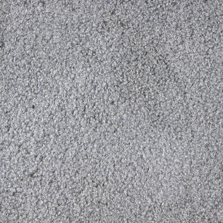 Color/Finish variation image for Vietnam Black Basalt. The surface finish shown is fine bush hammered. The dominant color shown is gray; with blue and white secondaries. The color mix creates a cool feeling. Speckled color pattern.