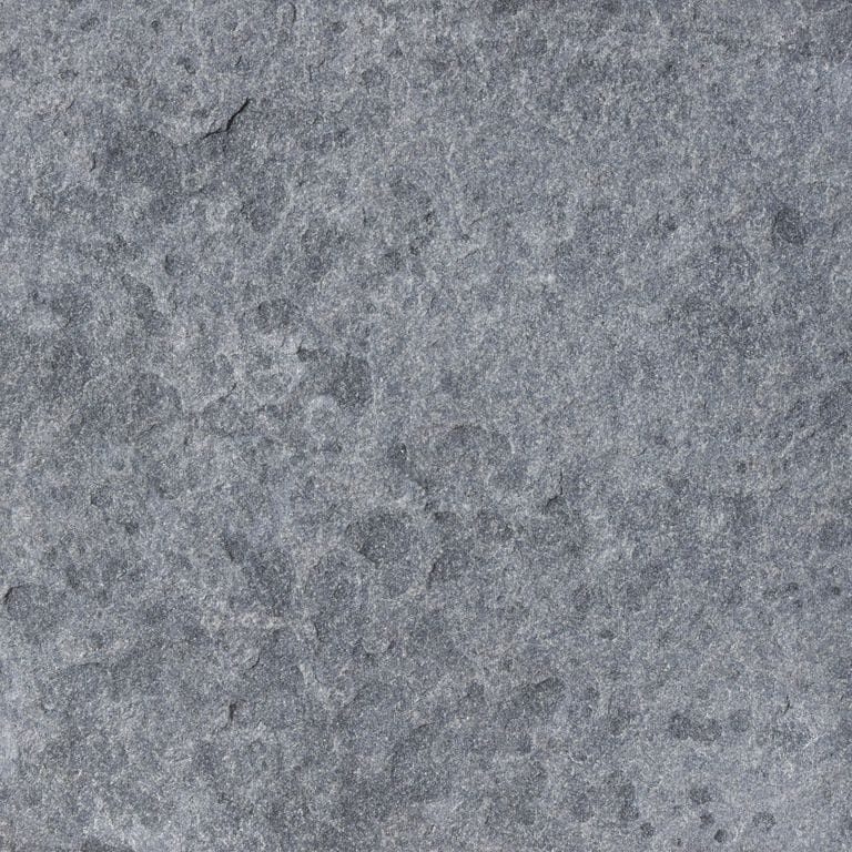 Color/Finish variation image for Vietnam Black Basalt. The surface finish shown is flamed. Dominant colors shown are blue and gray. The color mix creates a cool feeling. Fine speckled and blotched color patterns.