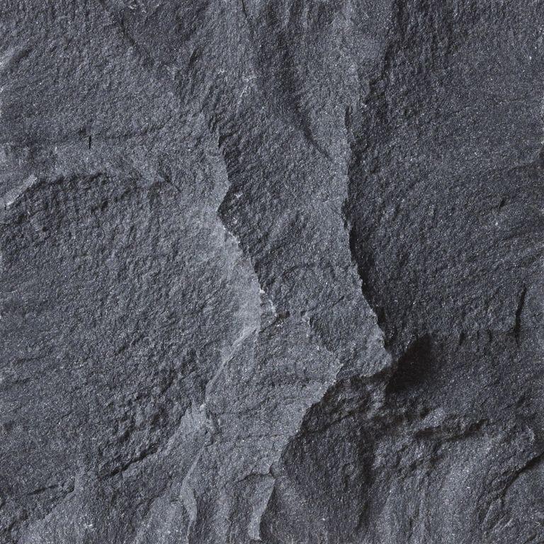 Color/Finish variation image for Basalt - Vietnam Black. The surface finish shown is split-face. Dominant colors shown are black and gray; with blue, brown and purple secondaries. Exhibits "movement" and the color mix creates a cool feeling. Regular color pattern.