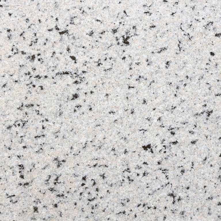The surface finish shown is flamed. Dominant colors shown are gray and white. The color mix creates a cool feeling. Coarse speckled color pattern.