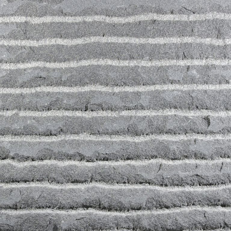 Color/Finish variation image for Sugus Bluestone. The surface finish shown is point stalk. The dominant color shown is gray; with a white secondary. The color mix creates a cool feeling. Fine speckled and linear color patterns.
