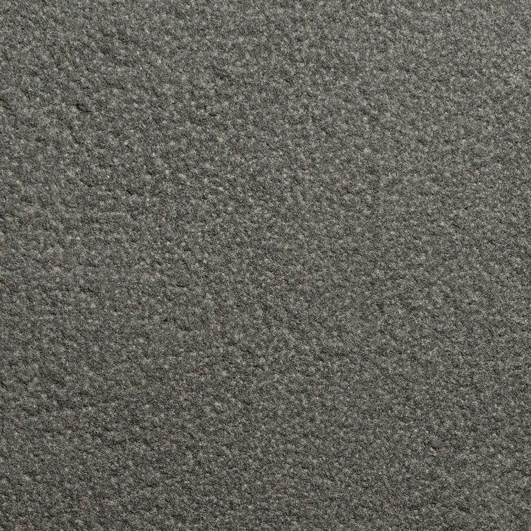 Color/Finish variation image for Sugus Black Sandstone. The surface finish shown is bush hammered. Dominant colors shown are black and gray. The color mix creates a cool feeling.