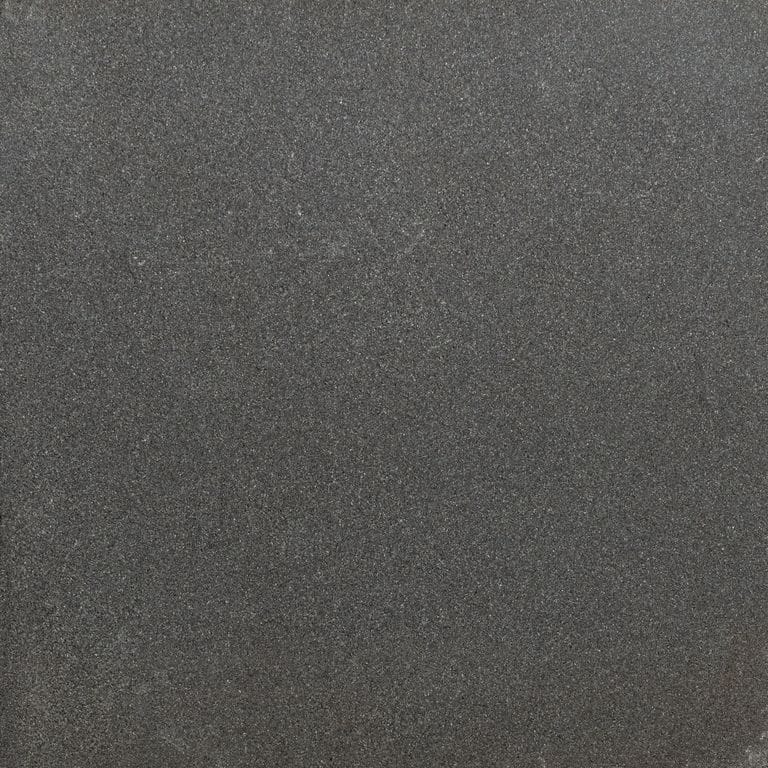 Color/Finish variation image for Sugus Black Sandstone. The surface finish shown is honed. Dominant colors shown are black and gray. The color mix creates a cool feeling.