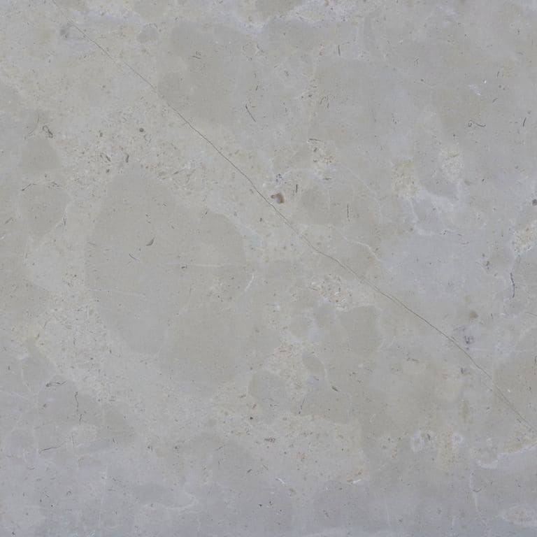Color/Finish variation image for Estrema Light Limestone. The surface finish shown is brushed. The dominant color shown is gray. Exhibits "movement" and the color mix creates a cool feeling. Cloudy color pattern.