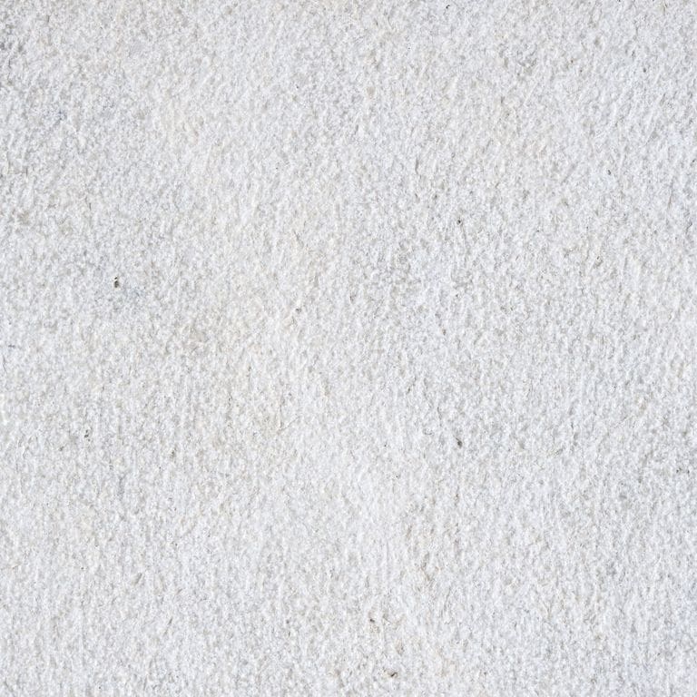 Color/Finish variation image for Limestone - Dalmatian. The surface finish shown is fine bush hammered. Dominant colors shown are gray and white; with beige and cream secondaries. The color mix creates a cool feeling. Cloudy color pattern.